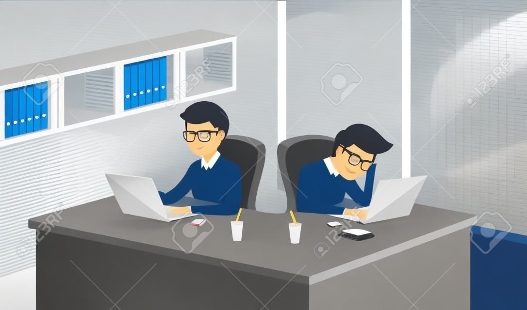 People working in an office with a computer