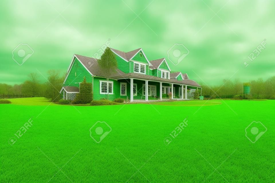 Large farm country house with spring green landscape, kids play ground.