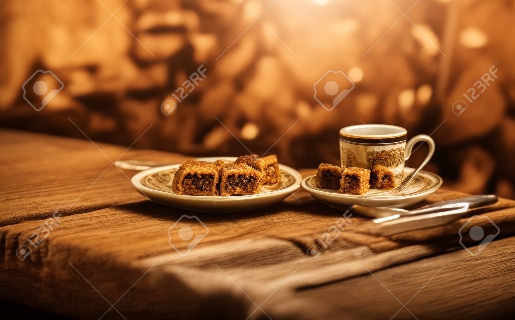 Turkish coffee, baklava and Turkish delight on the table. Photo toned and shallow depth of field