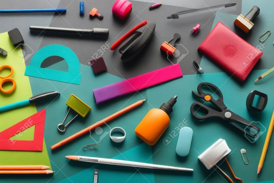 various accessories for study on a multi-colored background. back to school concept