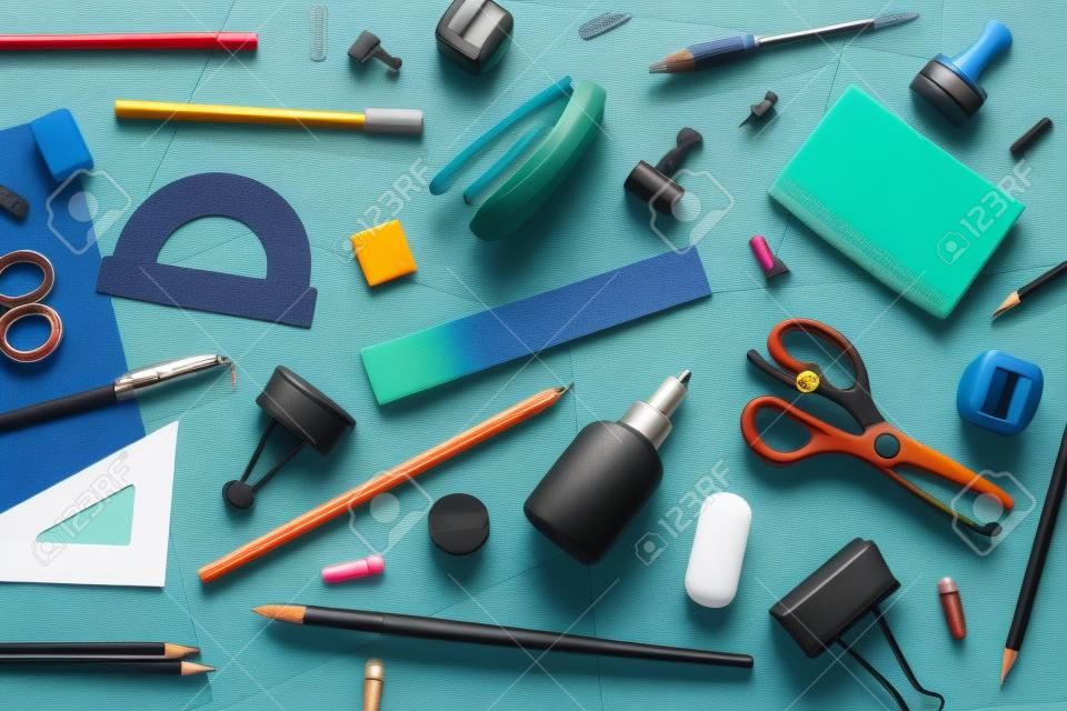 various accessories for study on a multi-colored background. back to school concept