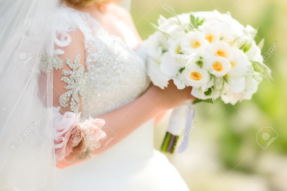 Wedding flowers bouquet with spikelets in background