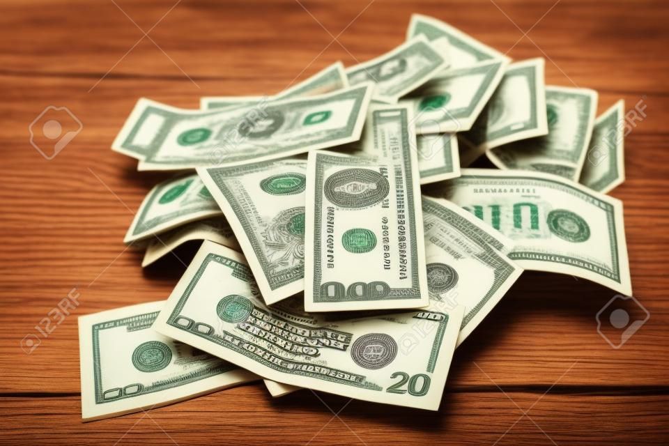 money isolated on a wooden background
