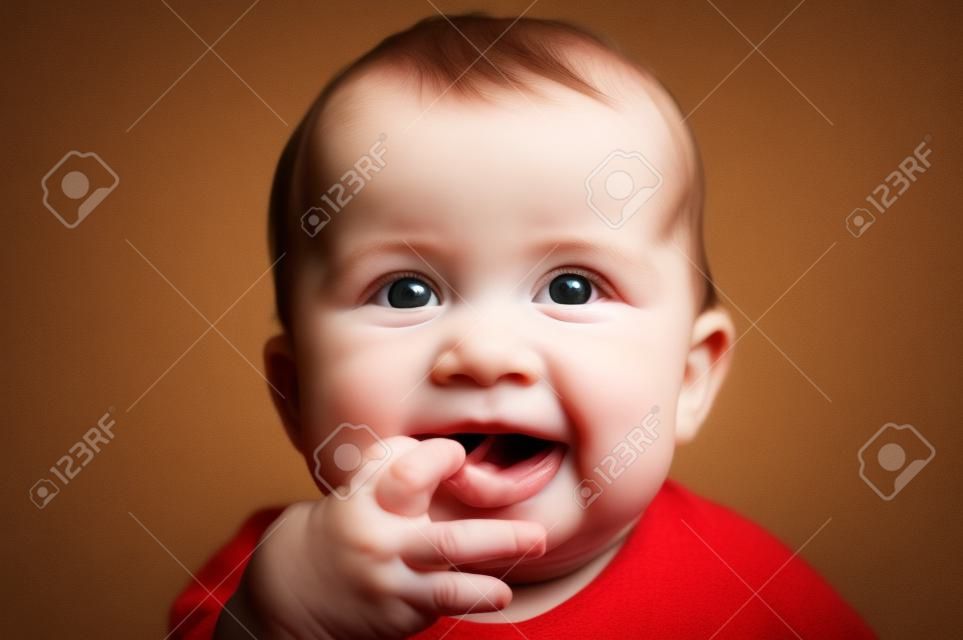 nice baby with fingers in mouth