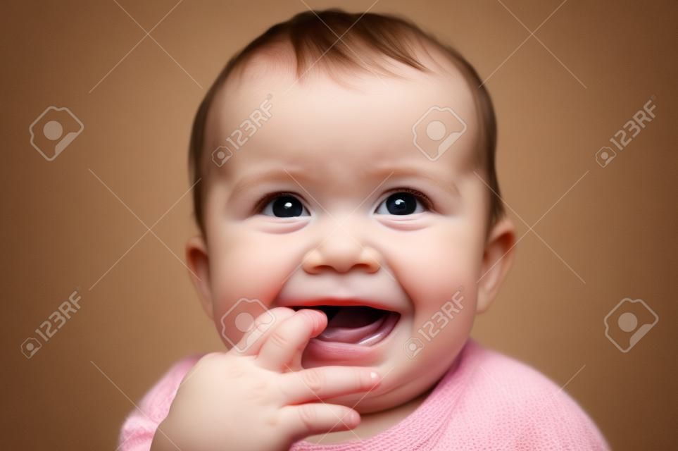 nice baby with fingers in mouth