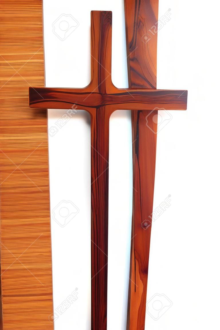 Simple wooden Christian cross isolated over white