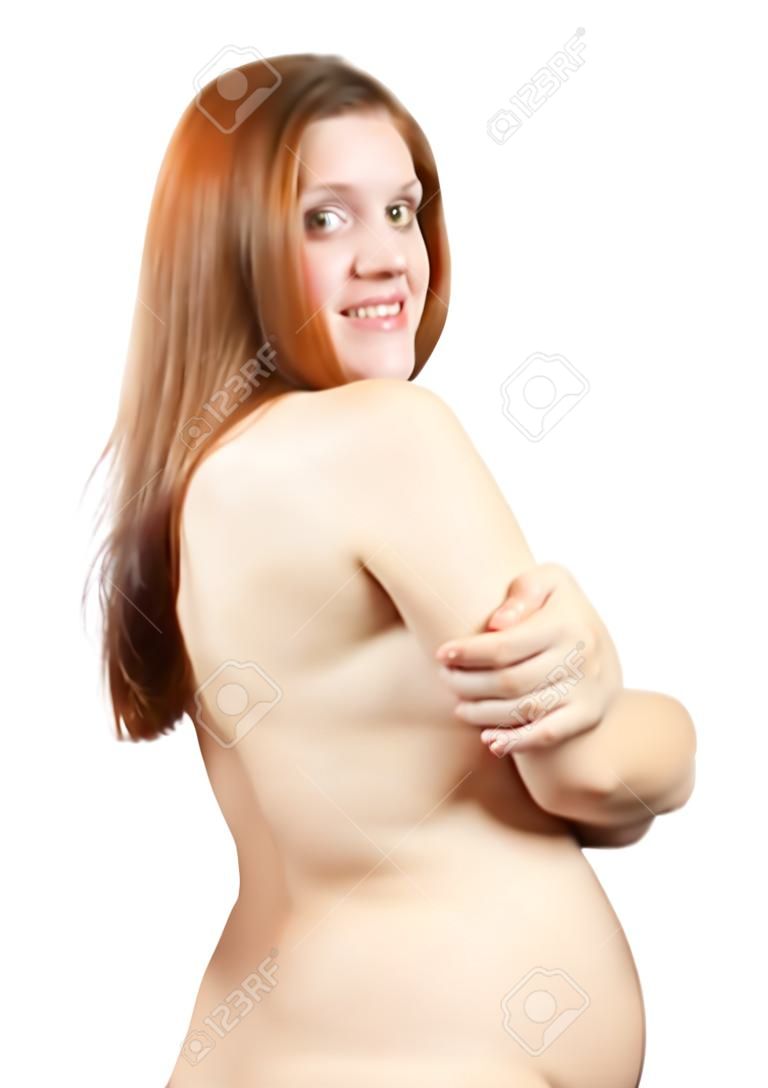 Portrait de femme enceinte de quatre mois sur blanc