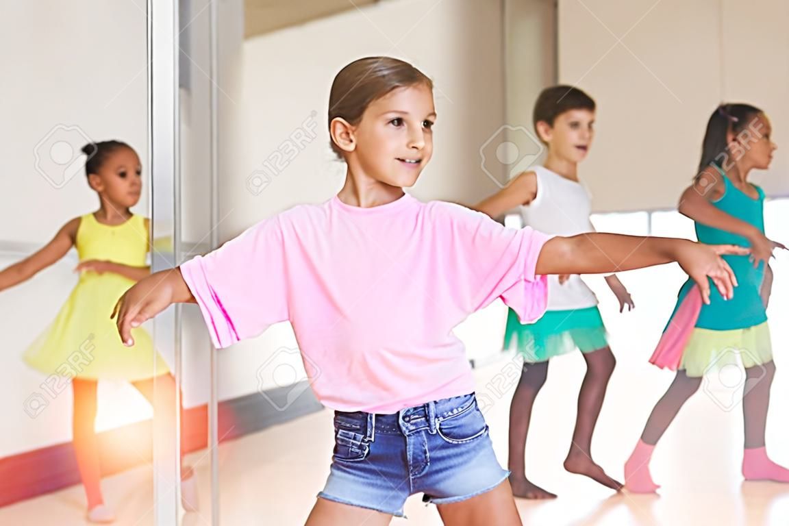 Dance class for kids, girls and boys training in dance studio