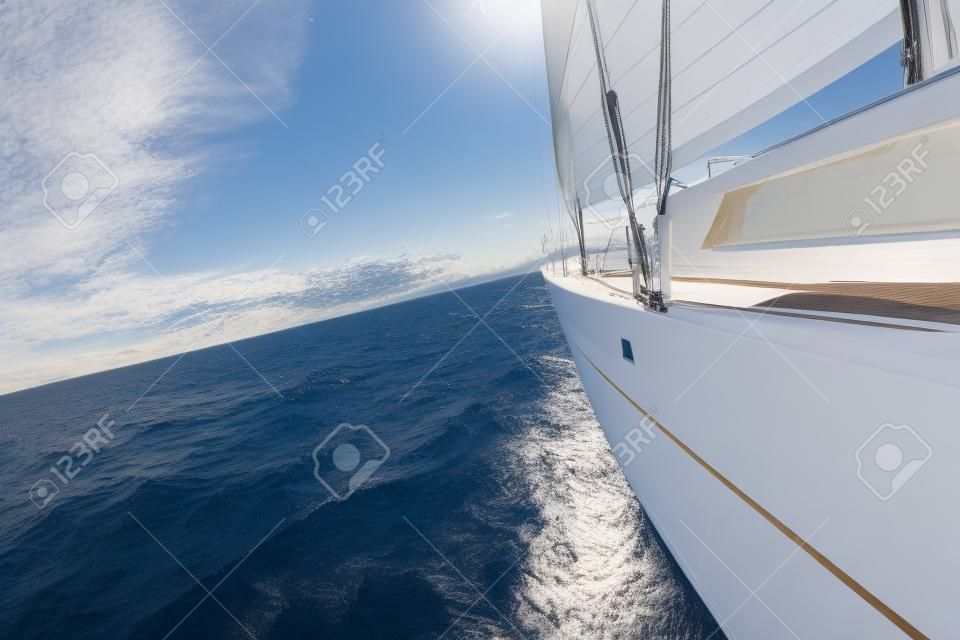 Detail of sailing yacht during voyage. Summer sport and recreation activities.
