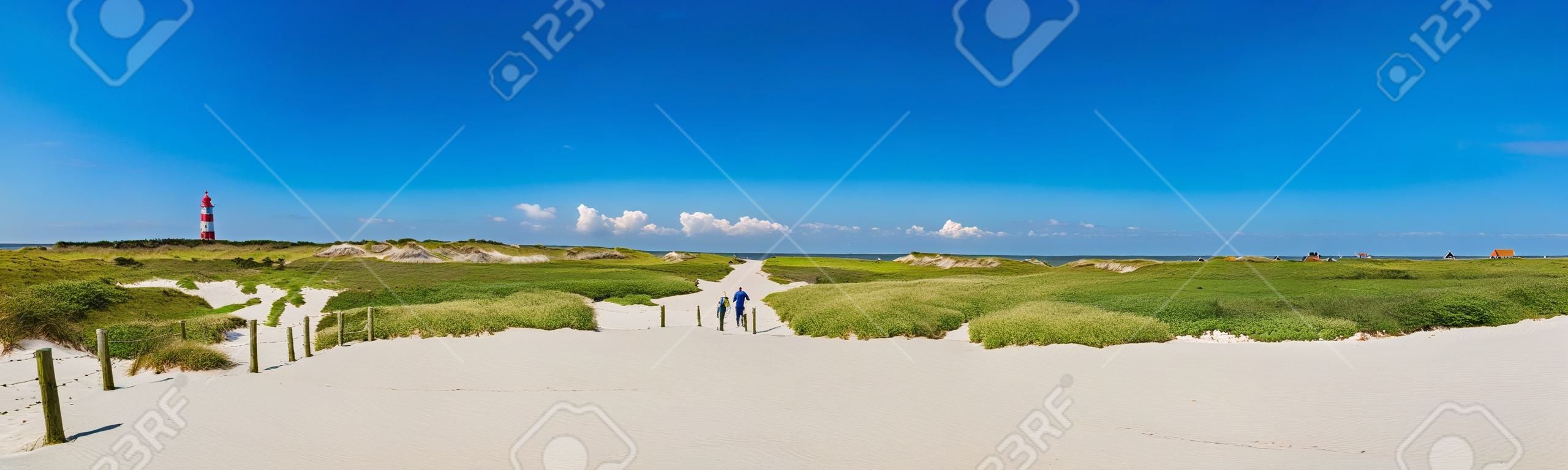 Beautiful dune landscape with traditional lighthouse on the island of Amrum at North Sea, Schleswig-Holstein, Germany