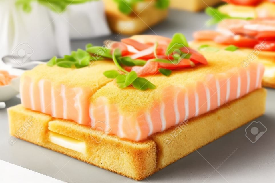Smörgåstårta, Swedish sandwich like cake or sandwich torte is a dish with seafood ingredients like salmon, shrimps and prawns.