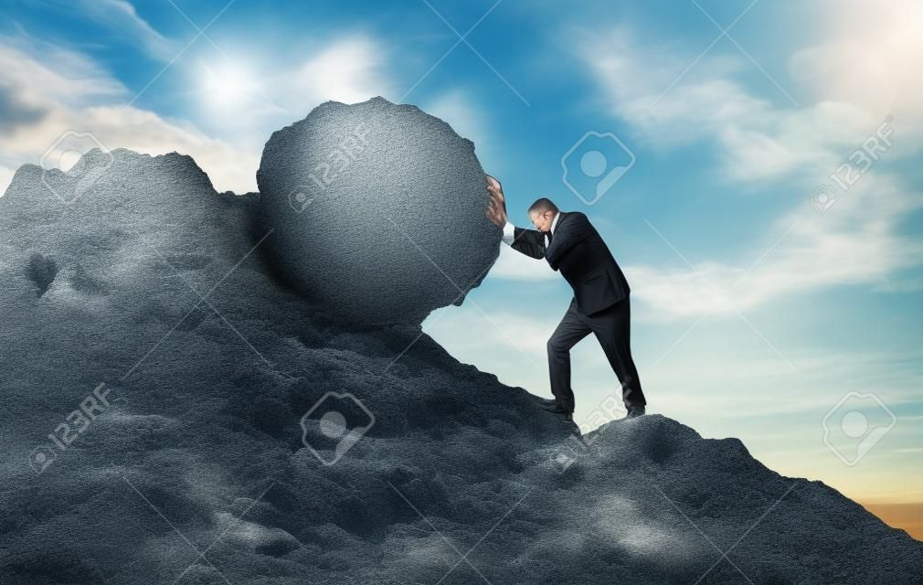 Business man pushing large stone up to hill , Business heavy tasks and problems concept.