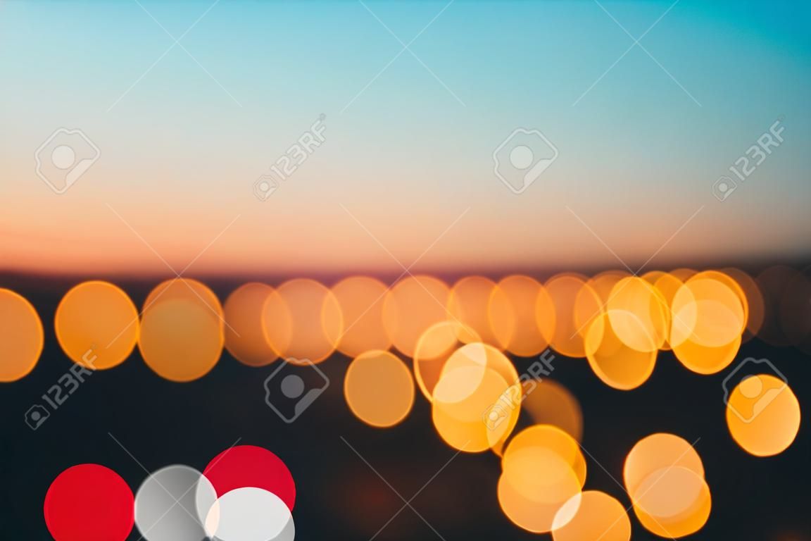 city lights abstract circular bokeh on evening sky background