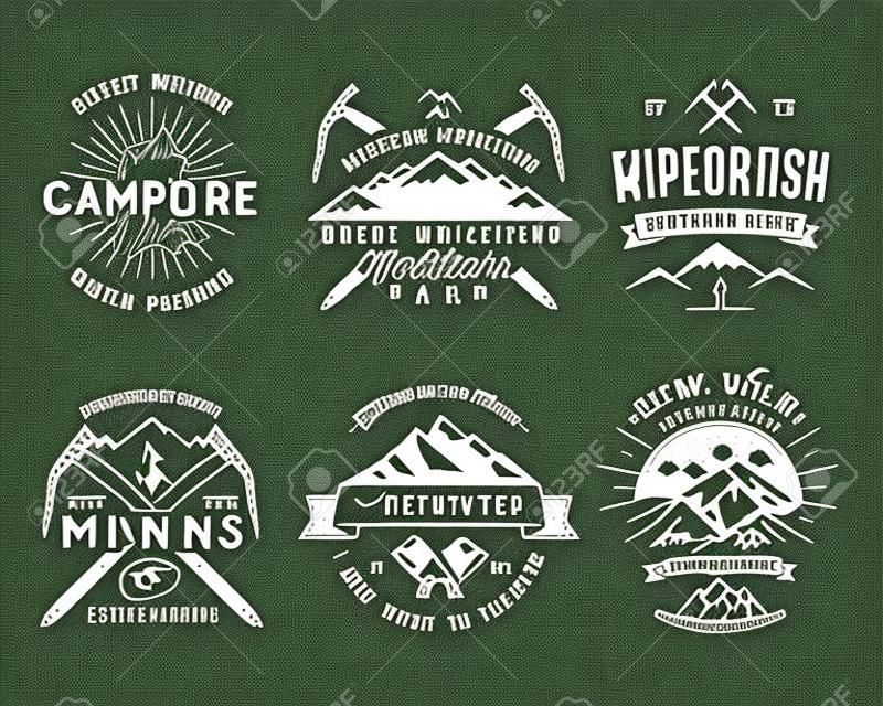 Set of mountain climbing labels, mountains expedition emblems, vintage hiking silhouettes logos and design elements. retro letterpress style isolated. Wilderness patches isolated on white