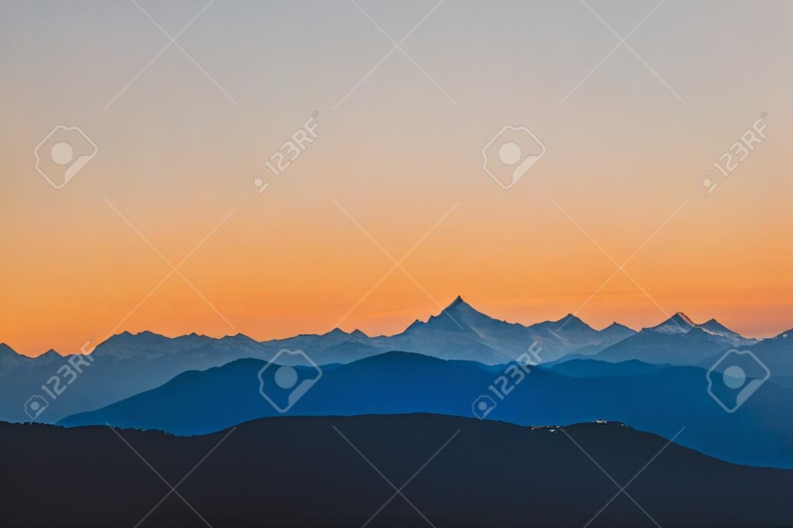 Beautiful swiss mountain layers at sunset