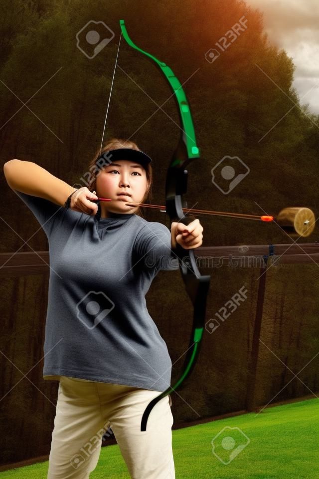 Female with crossbow arrows bow. The Archer takes aim, sharpshooter. Crossbow club.
