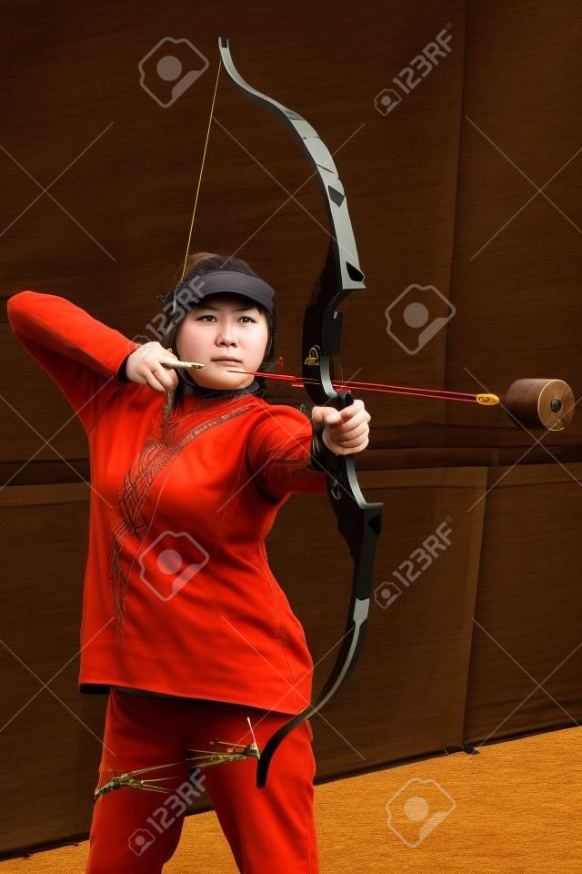 Female with crossbow arrows bow. The Archer takes aim, sharpshooter. Crossbow club.