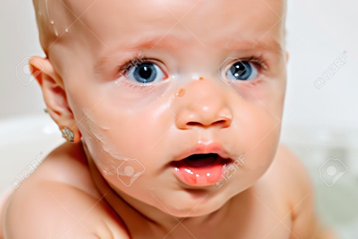 Portrait of cute baby in a bath.