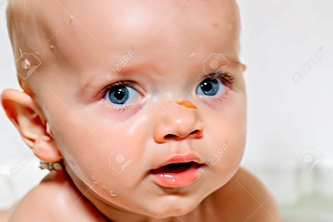 Portrait of cute baby in a bath.