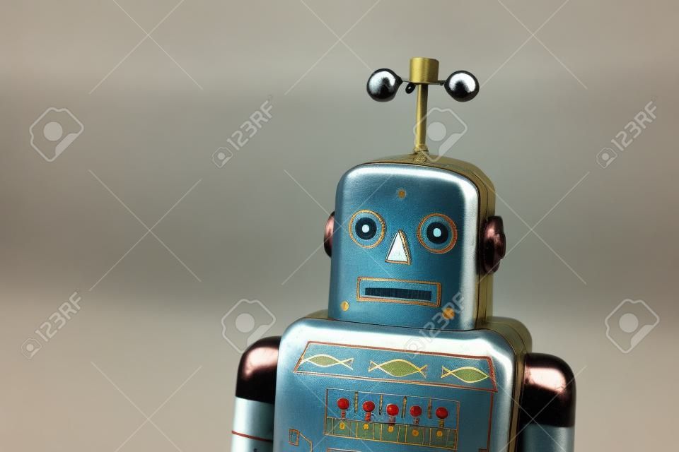 Vintage tin toy robot isolated, drone delivery artificial intelligence concept 