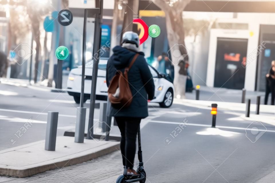 Tel Aviv Israel January 03, 2020 View of unidentified people rolling with an electric scooter in the streets of Tel Aviv in winter