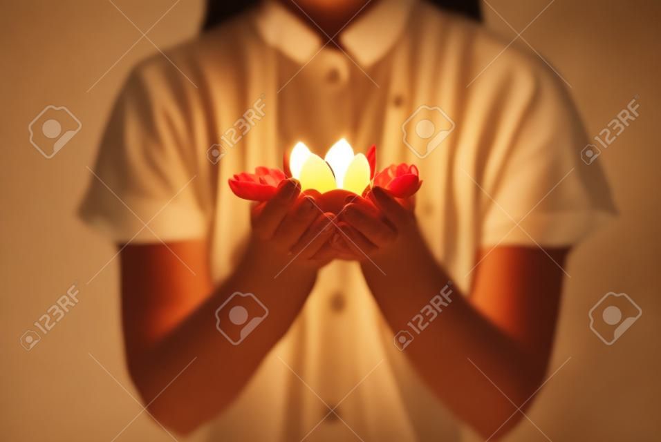 lotus candle holder laying on woman hands.