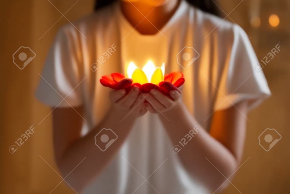 lotus candle holder laying on woman hands.