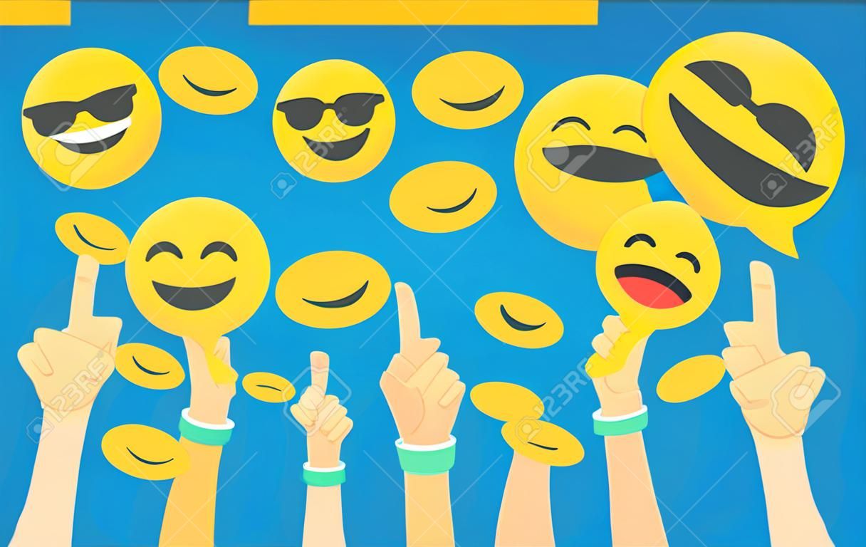 Emoji concept vector illustration happy men and women showing emoji head symbols for emotional reactions. Flat human hands hold laughing and smiling emoticons on blue background