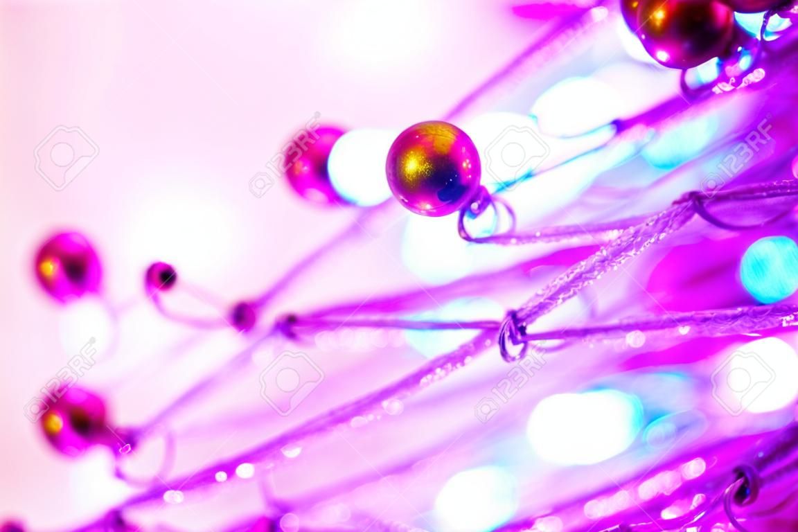 Christmas background of bokeh lights with close up christmas tree