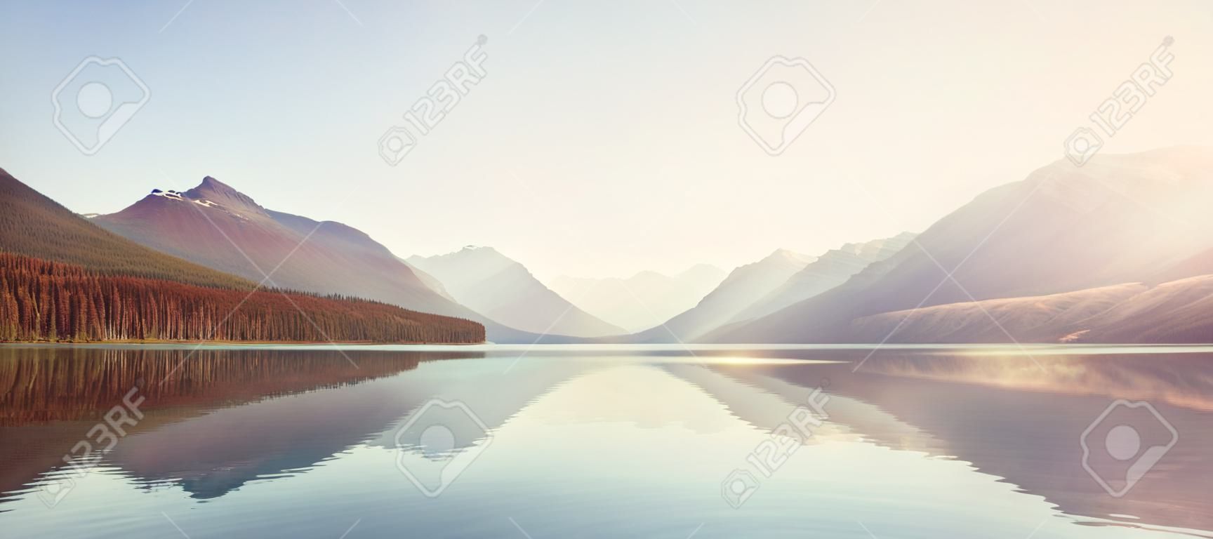 Beautiful Bowman lake with reflection of the spectacular mountains in Glacier National Park, Montana, USA.