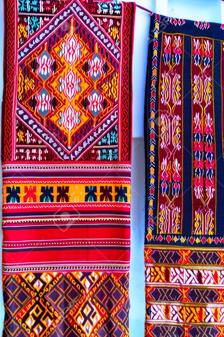 Colorful of native thai style silk and textiles pattern. Beautiful handmade woven fabrics thai silk fabric textured, with different native style patterns.