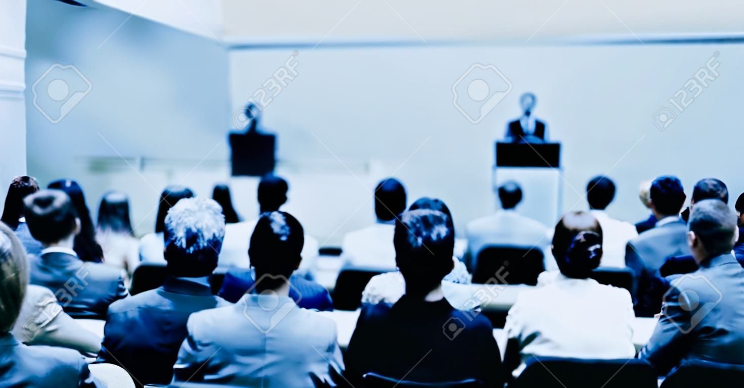 Woman giving presentation on a business conference.