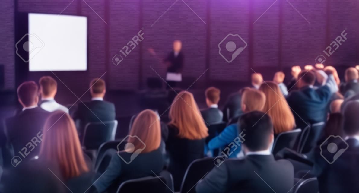 Speaker giving presentation on business conference.
