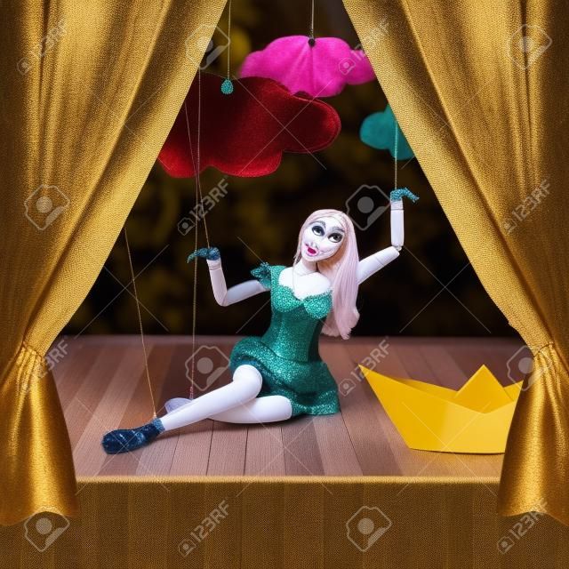 Beautiful woman marionette on stage puppet theater