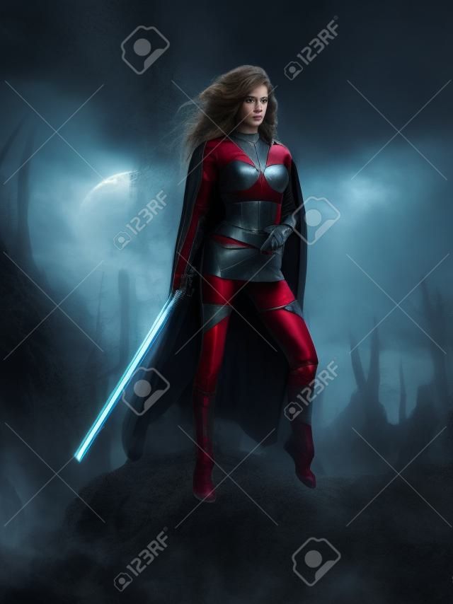 剣を保持している戦い sci fi の衣装に身を包んだ空想科学小説の女性