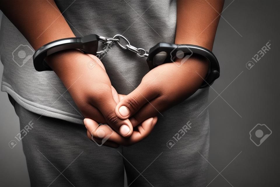 boy hands in handcuffs. no freedom