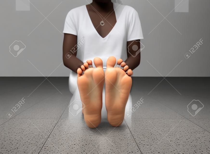 Bottom view of callused feet