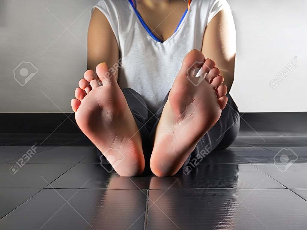 Bottom view of callused feet