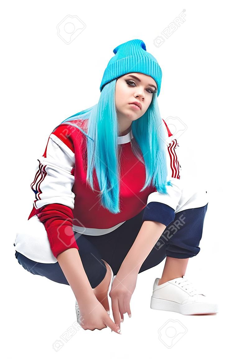 Trendy hip-hop young woman in squat