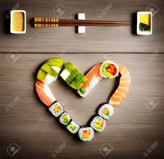 Traditional japanese sushi pieces on rustic concrete background.
