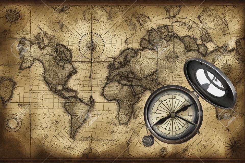 Stary zabytkowy sprzęt nawigacyjny na starej mapie świata.