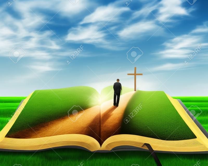 A nyitott biblia fű és egy férfi sétált felé, egy kereszt