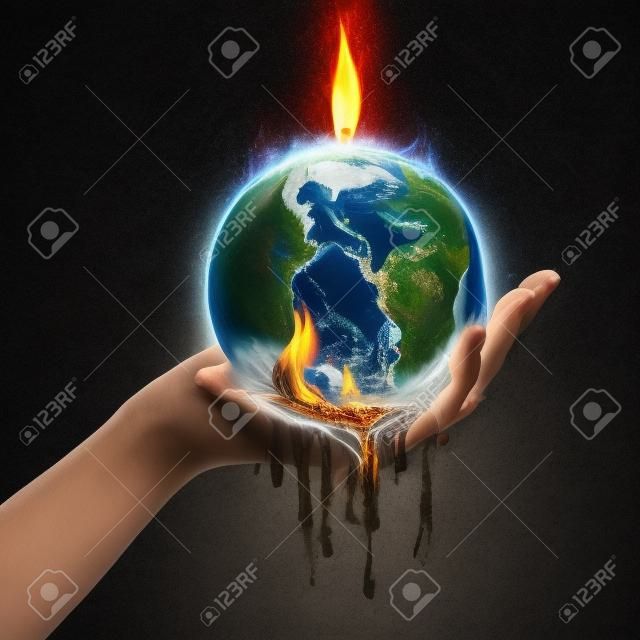 A hand holds up an Earth that is melting from the fire.
