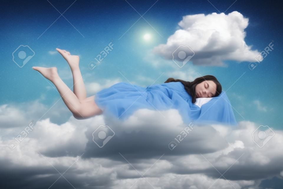 Relaxed girl in ruffle dress levitating in mid-air, sleeping on stomach lying comfortable cozy on pillow, keeping eyes closed, watching peaceful dream. collage composition on day cloudy blue sky