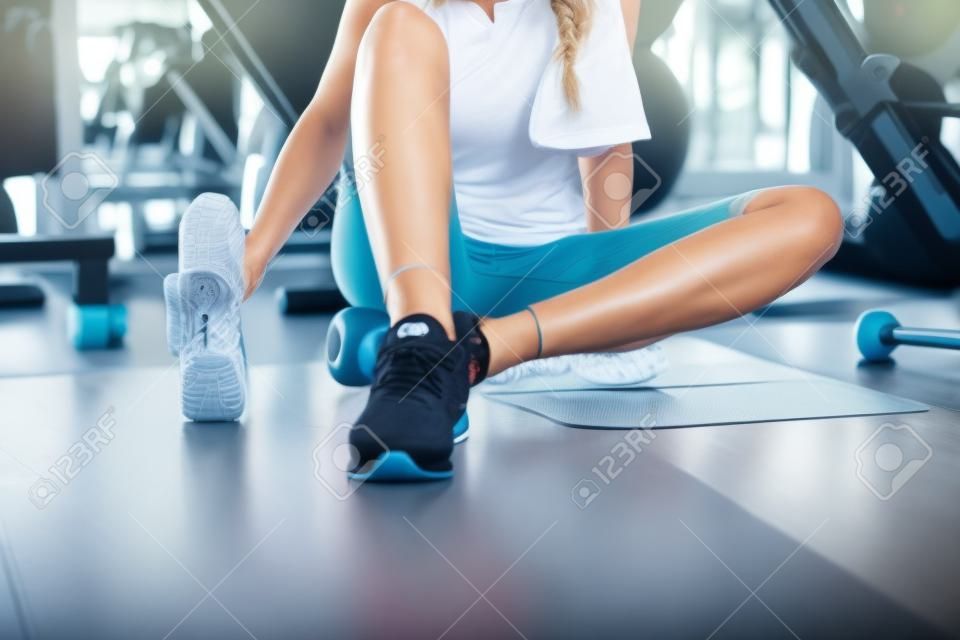Portrait of Pretty Caucasian Woman is Exercised in Fitness Club, Attractive Woman is Resting After Working Out Jogging on Treadmill Machine in Gym., Sport Club and Healthy Concept.
