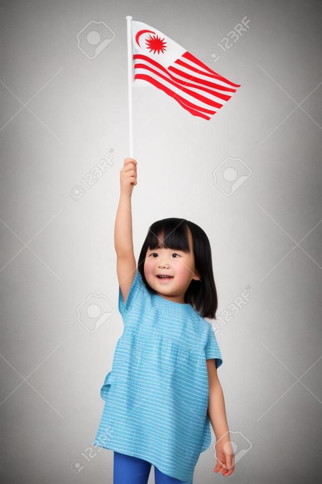 马来西亚白人儿童在白色背景下带着中国国旗