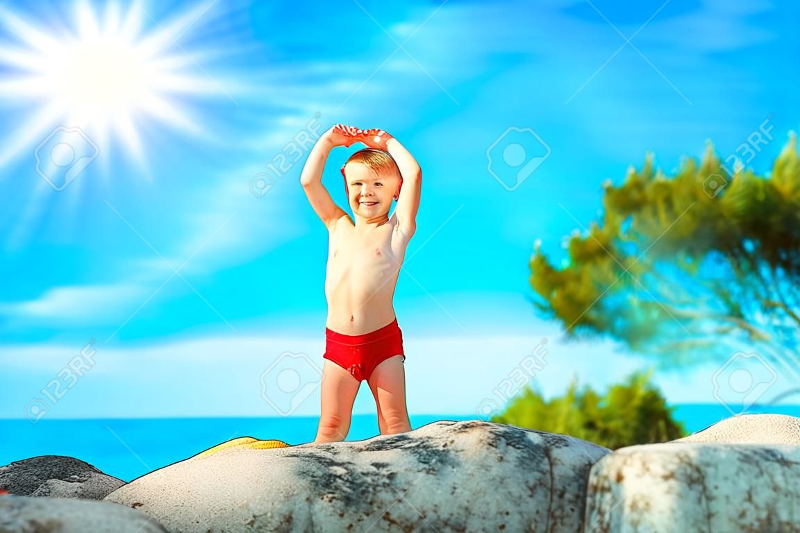 happy child playing by the sea