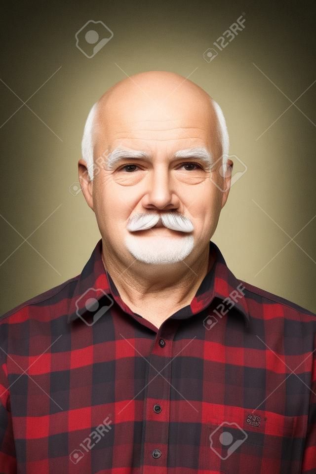 Elderly old man  with mustache, bald man in plaid shirt