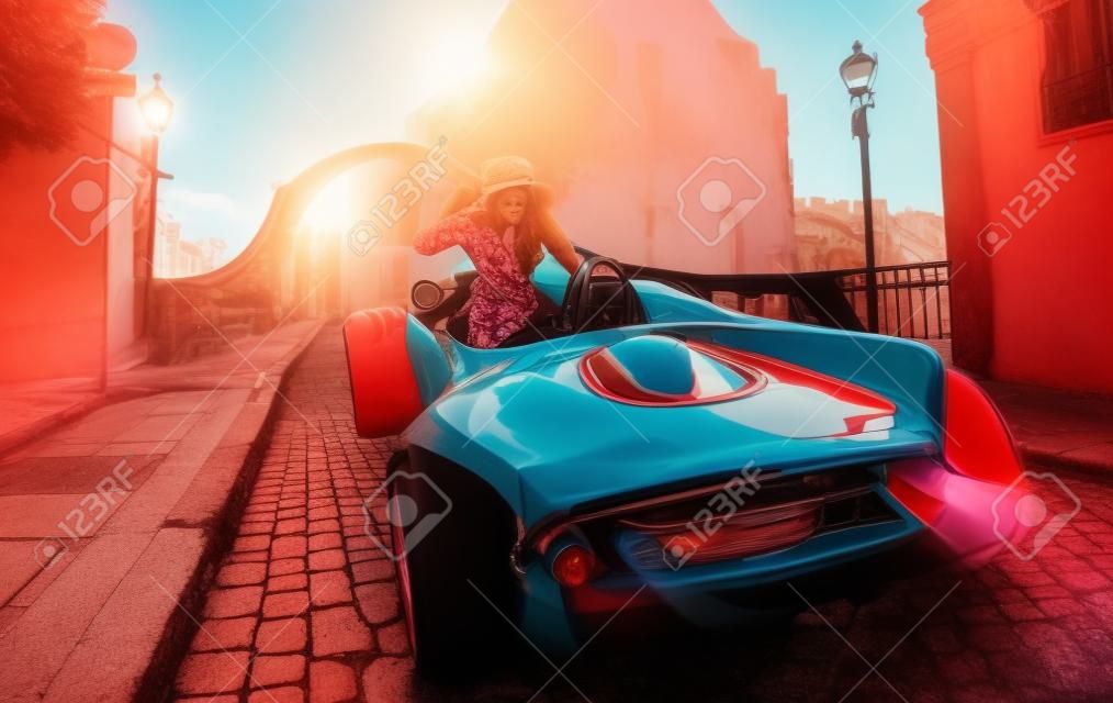 Colorful photo of female driver in old town