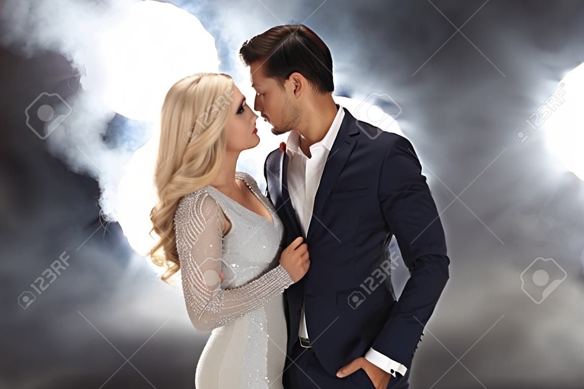 Romantic style portrait of an elegant couple in the night club